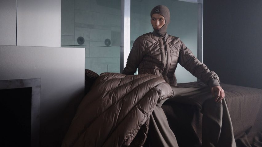 Model wearing long black puffer Moncler