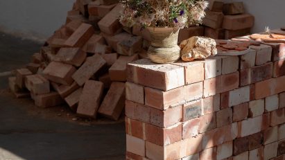 Photo of a stack of bricks in the Clay, Library, Land Studies exhibition
