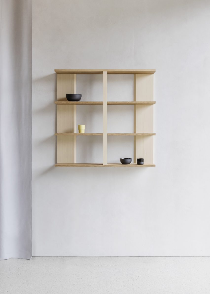Wooden shelf on white wall