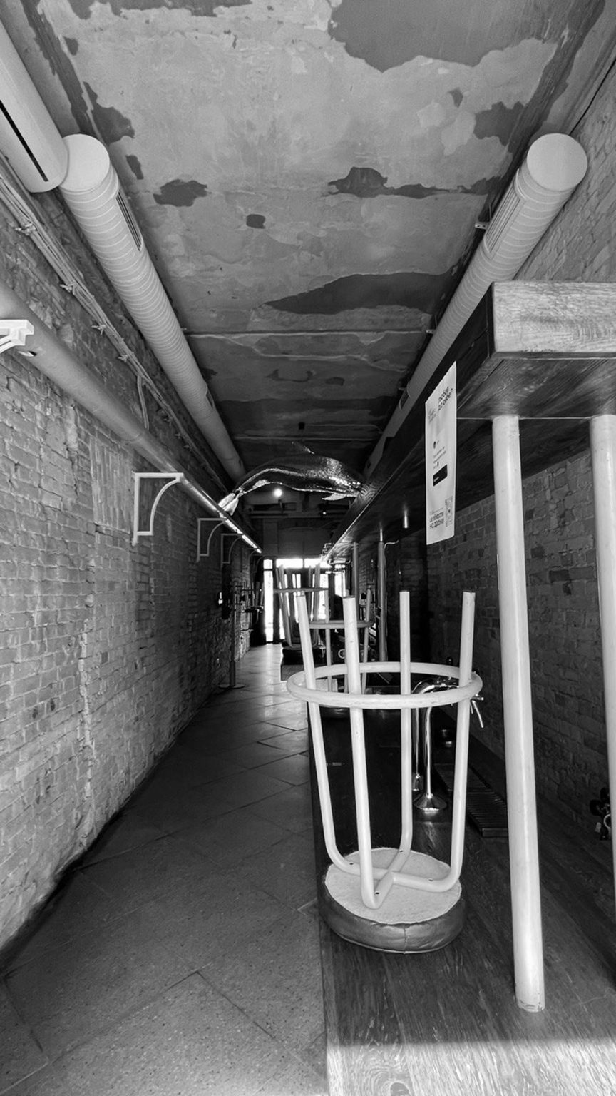 Black and white photo of the interior before remodelling