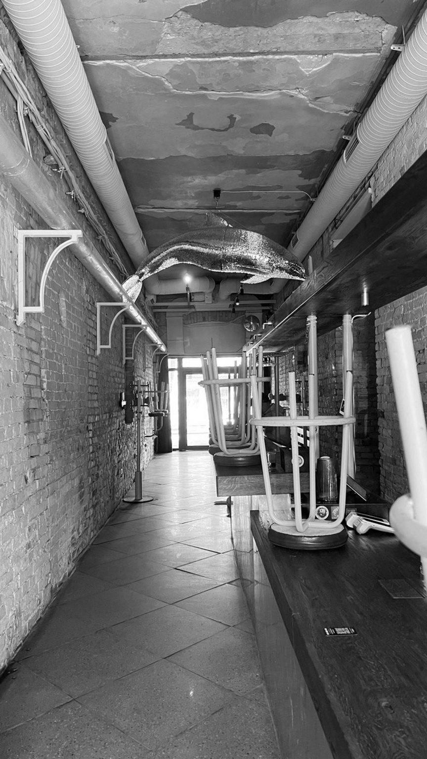 Black and white photo of the interior before remodelling