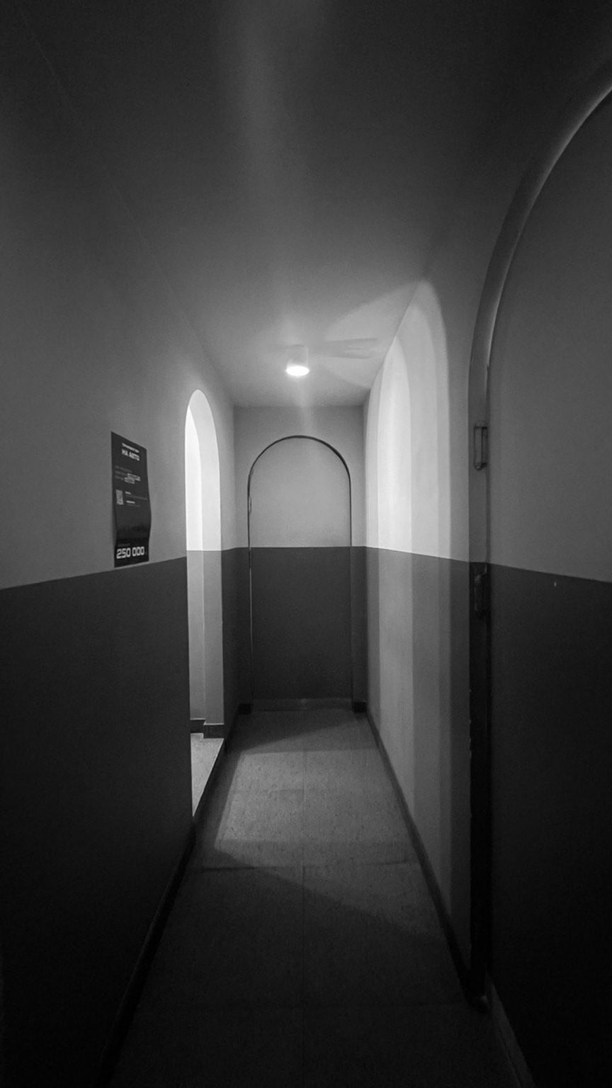 Black and white photo of the interior before remodelling