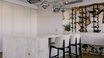 Stone kitchen island and wine rack Maltese apartment
