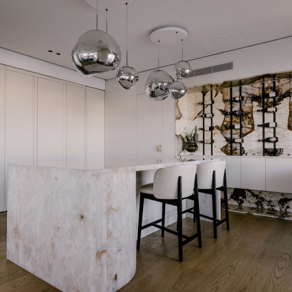 Stone kitchen island and wine rack Maltese apartment