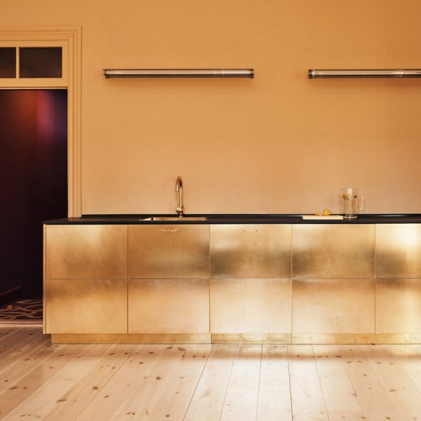 Kitchen with metallic gold units
