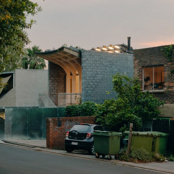 Melnourne house with curved roof at dusk