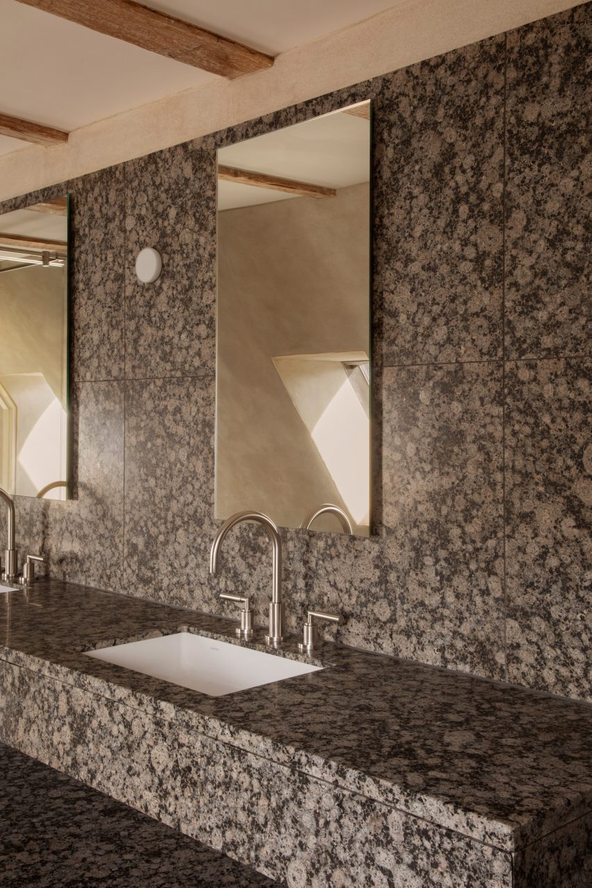 Grey granite twin bathroom sink and mirrors