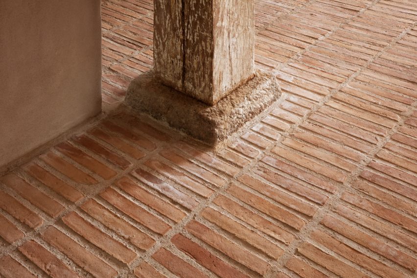 Thin red brick floor downstairs of Strandgade warehouse
