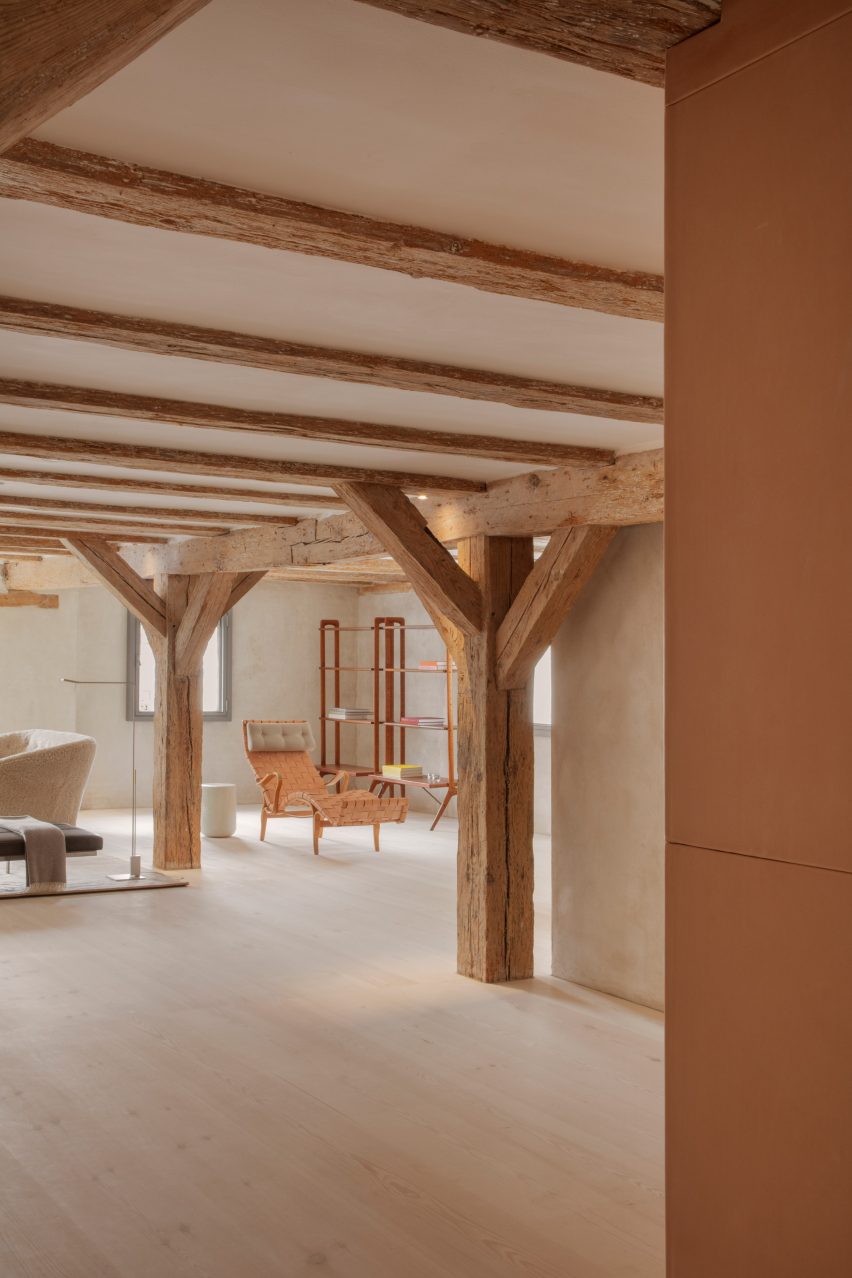 Structural wooden beams and furniture in open plan space