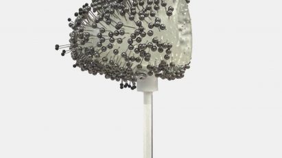A visualisation of an abstract image, showing grey stems with circular forms at the top, as well as dark grey spherical forms coming out of it.