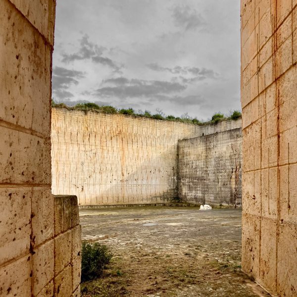 A photograph of brown stone walls.