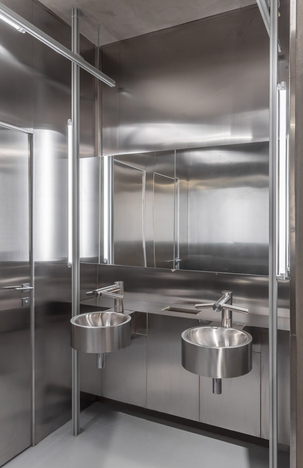 Stainless steel bathroom basins inside listening bar Bucharest