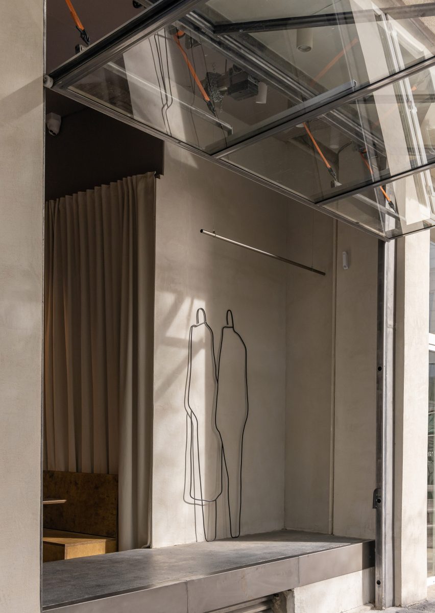 Concrete bench and open folding glass facade