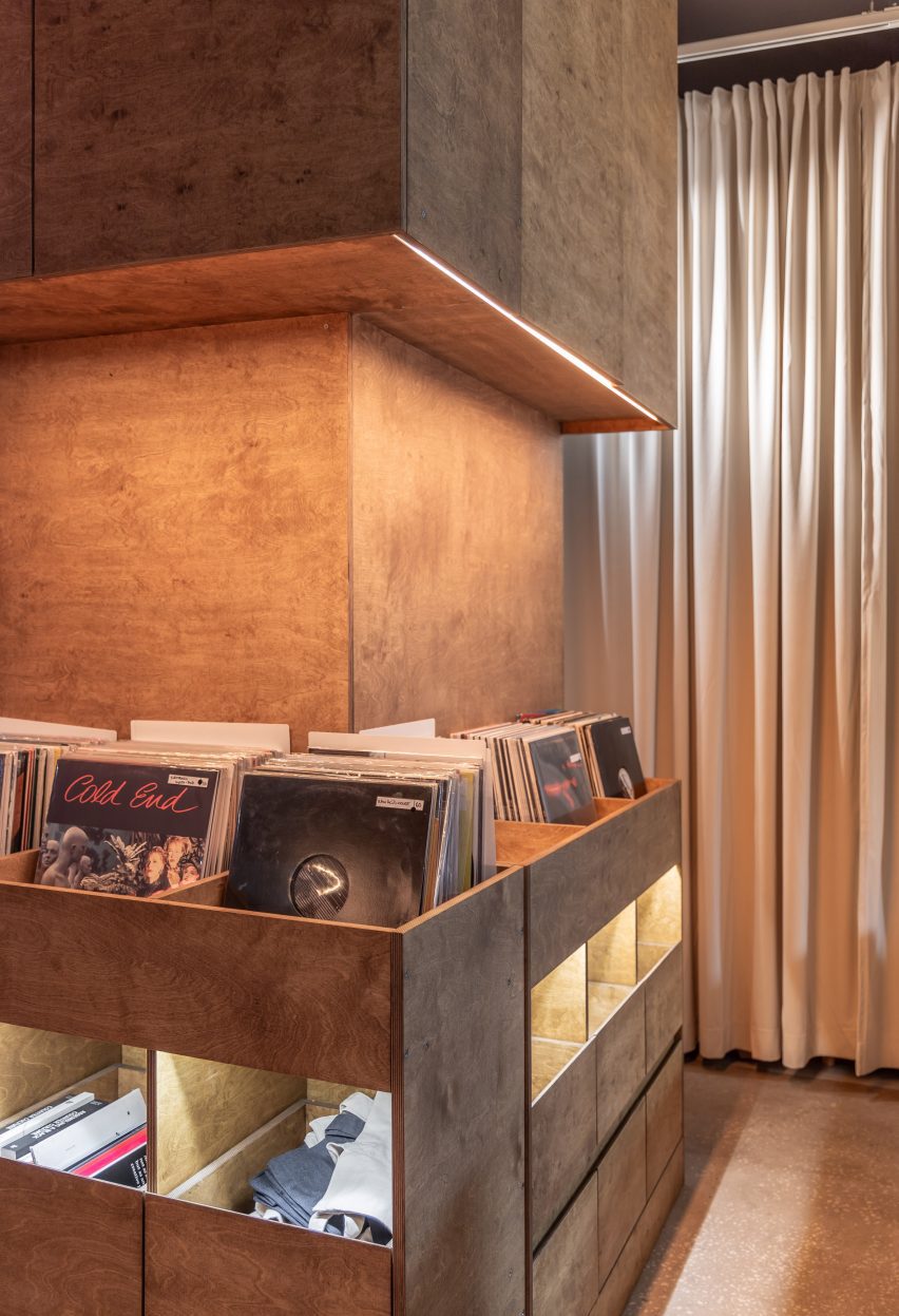 Records illuminated inside wooden shelving unit