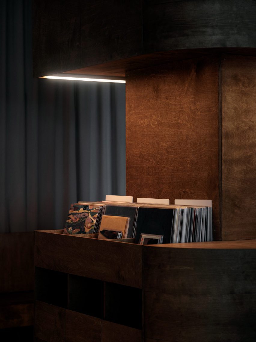Light highlighting records in birch plywood storage