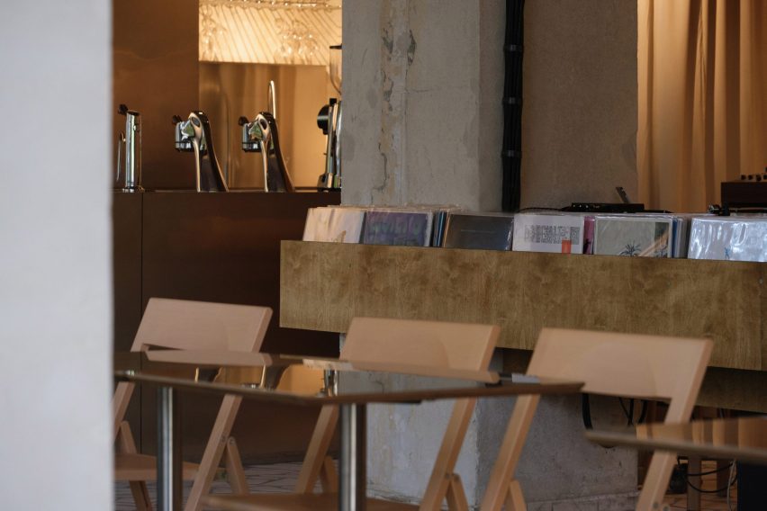 Seating and vinyl records inside listening bar