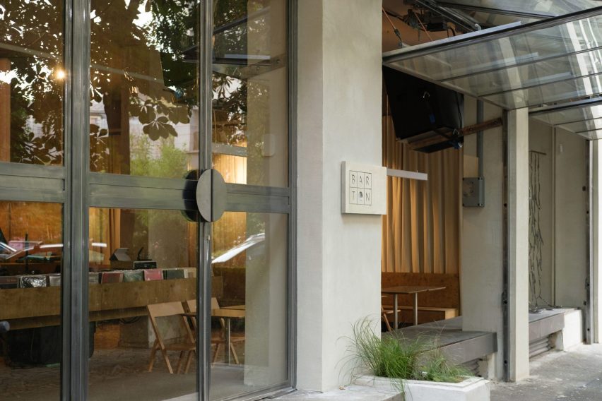 Exterior of Bar Ton Romania with folding mechanical glass facade