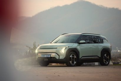 Kia EV3 car situated in mountain landscape