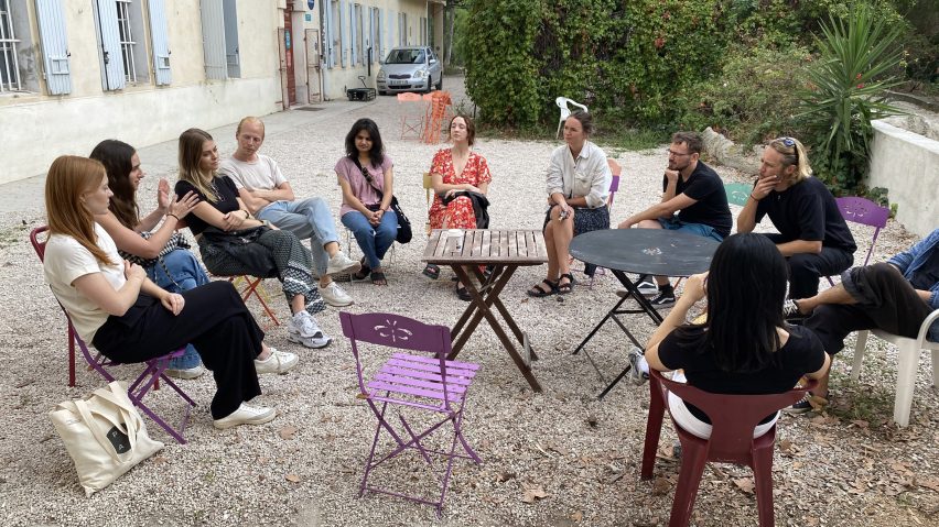 a group of people sat together outside