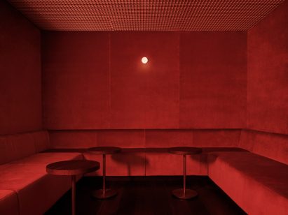 Burnt orange floor-to-ceiling seating area