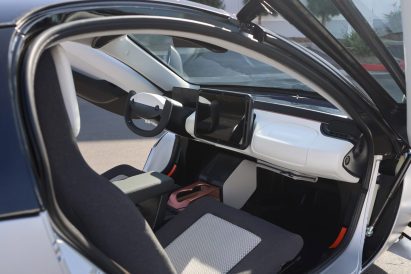 Photo of the interior of the first Aptera solar electric vehicle, viewed from the passenger side