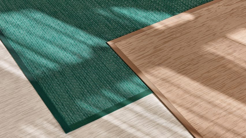 Green, brown and beige rugs on floor