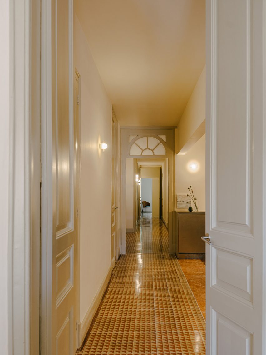 Hallway of Barcelona apartment with traditional mosaic tiled flooring