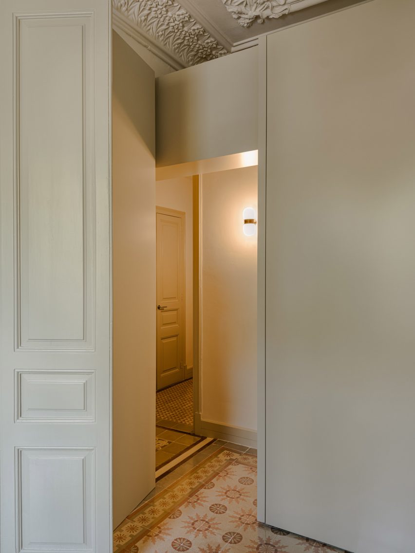 White room divider and red floor tiles