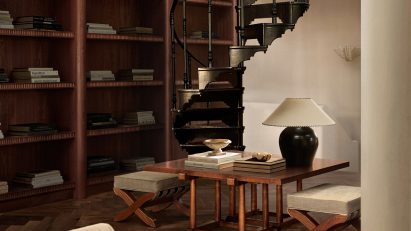 Wooden shelving and cream plaster walls