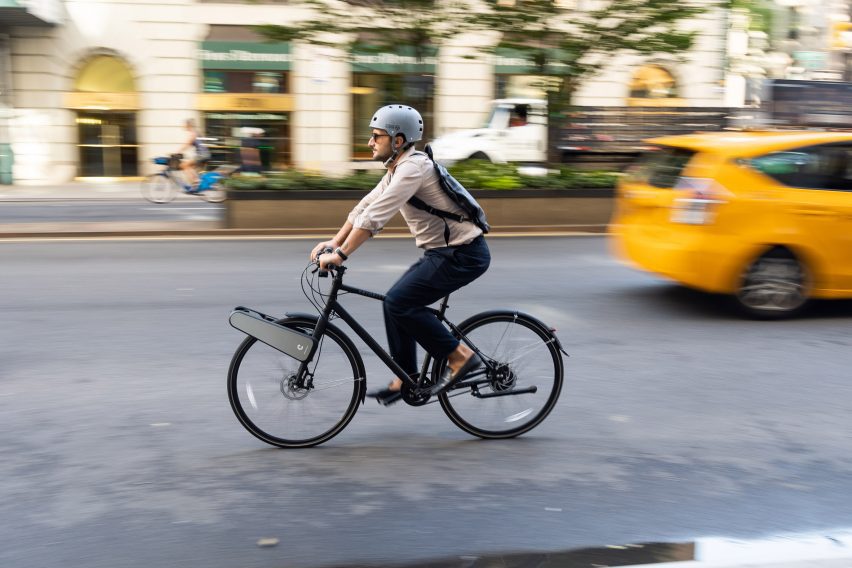 Urban commuter riding bike with electronic conversion kit