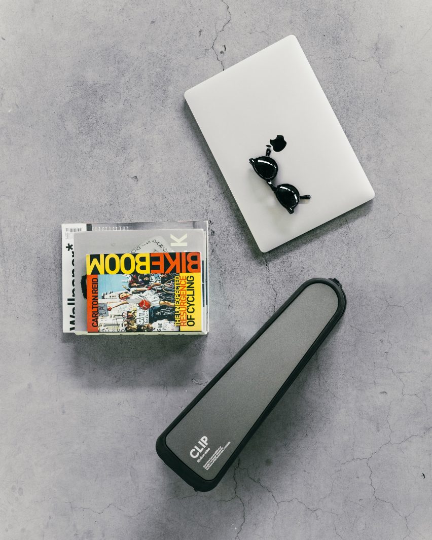 Friction drive bike converter beside laptop
