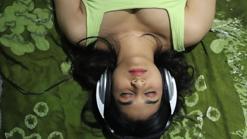 a person laid down with headphones on