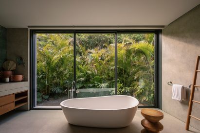 Bathroom with lush jungle views
