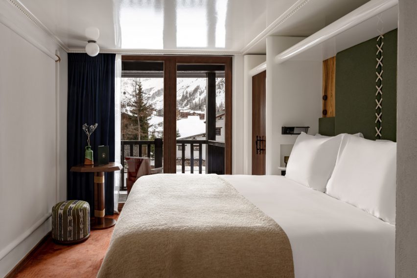 Bedroom with mountains beyond