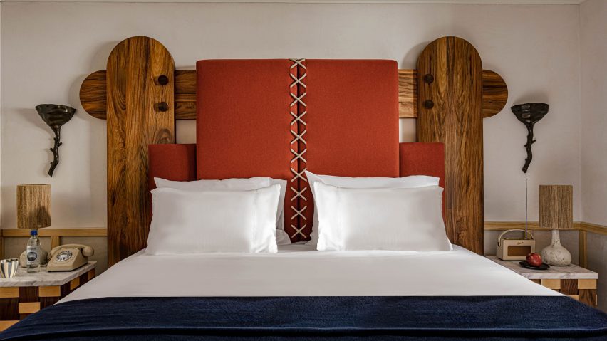 Bed head with wooden skis and orange felt panels