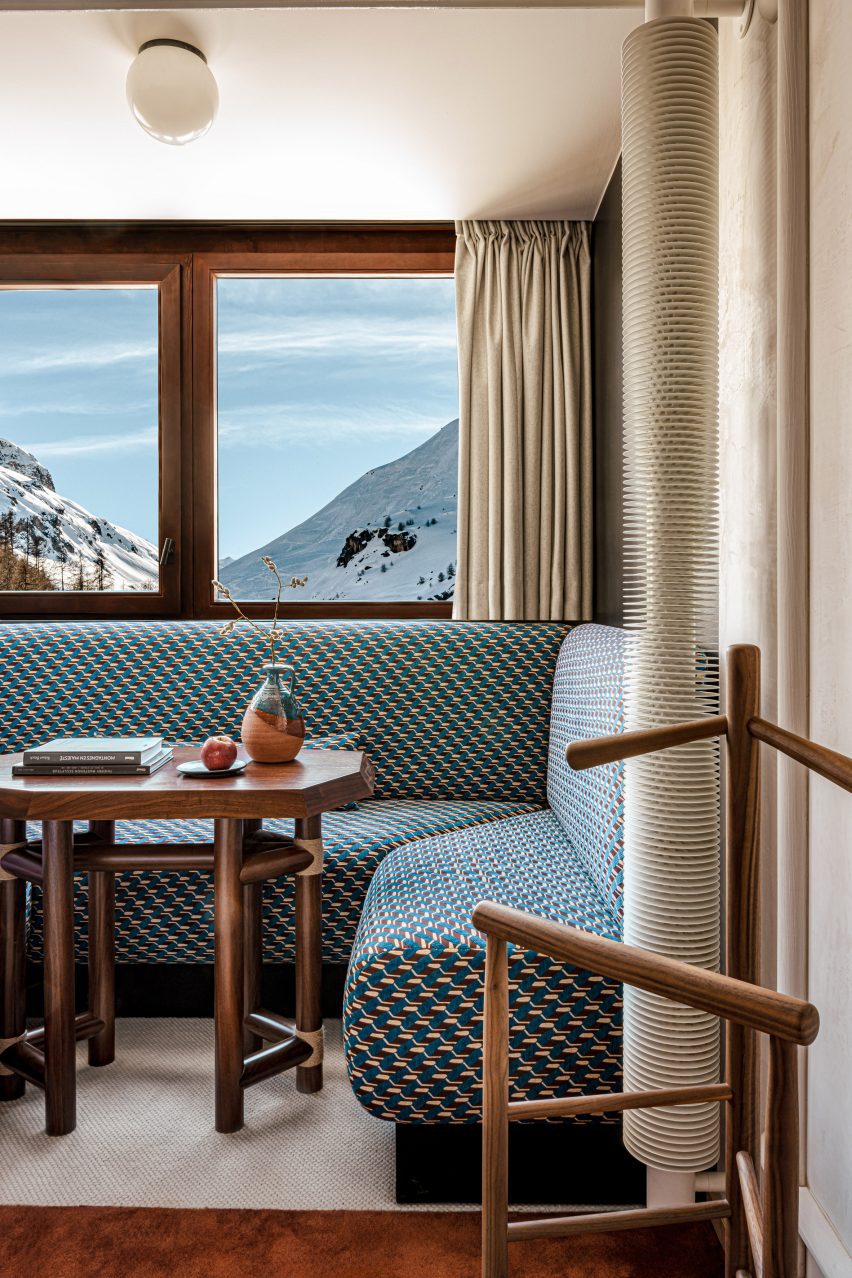 Rooms feature seating areas with colourful brocade upholstery