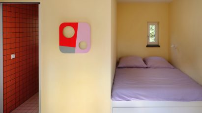 Pale-yellow bedroom in German holiday home