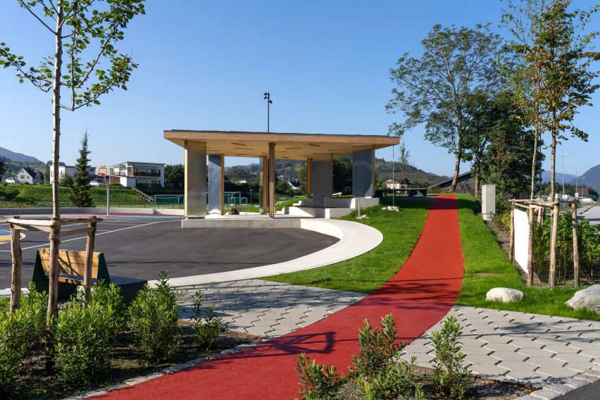 A red running track encircles the design