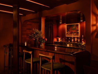 Mahogany bar with four stools