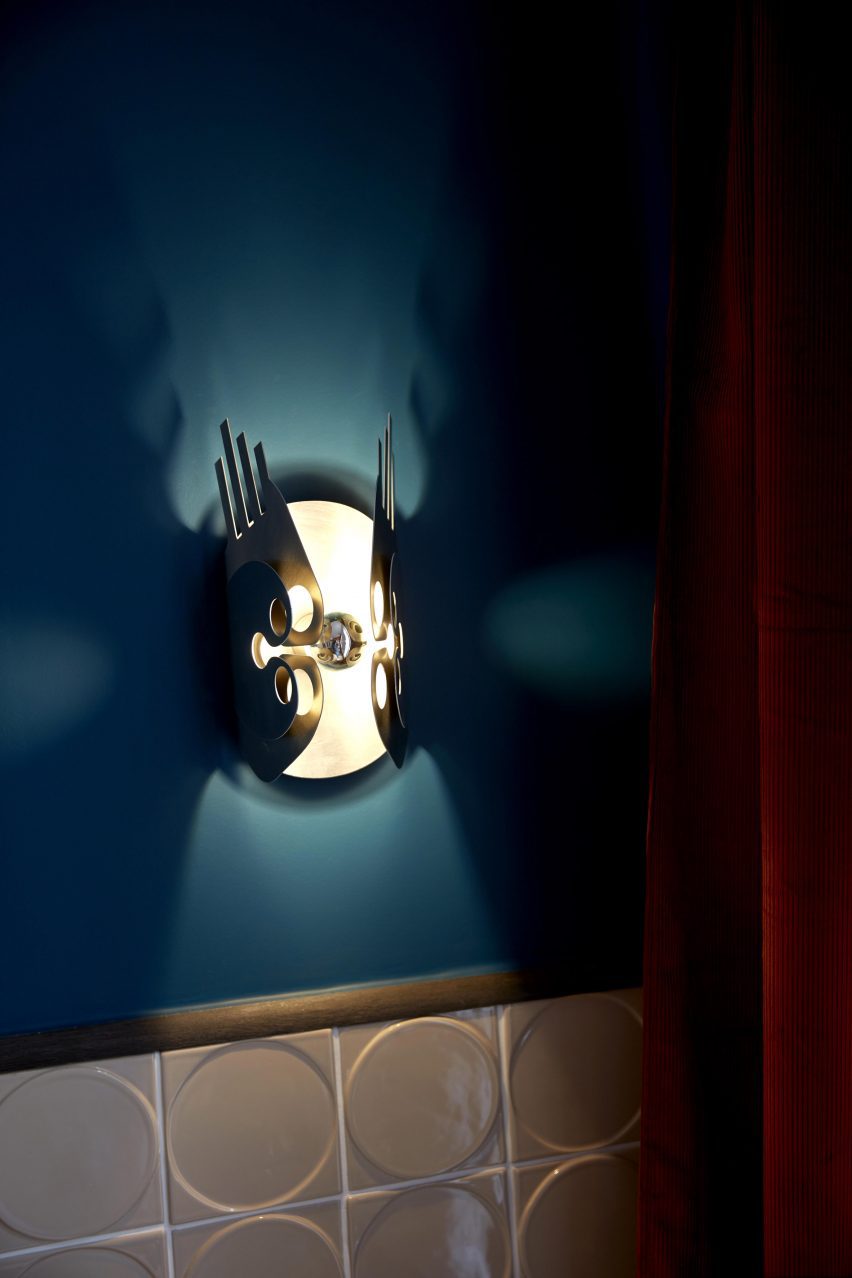 Sconce in Paris pied-à-terre by The House Special Studio.