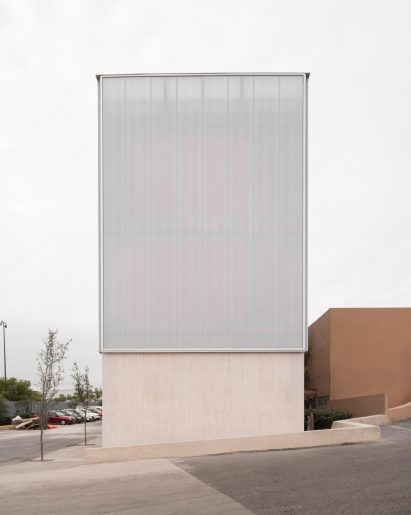 Polycarbonate-wrapped mass timber building