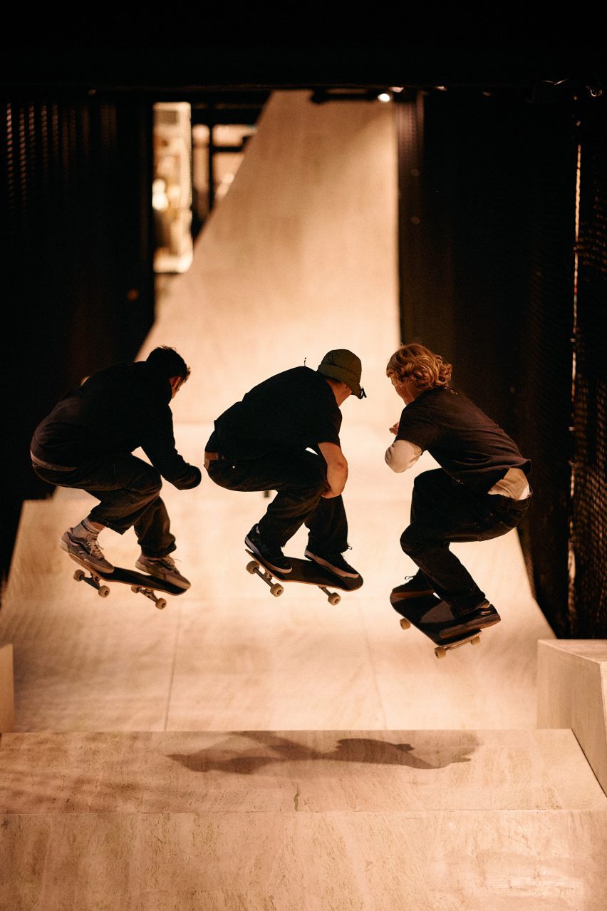 People skating in Vans store