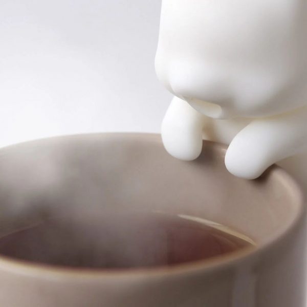 Cat shaped robot blowing on coffee