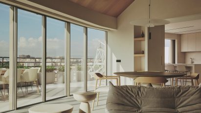 Photograph of an open-plan living and dining space with a large glass facade offering views of Valencia city