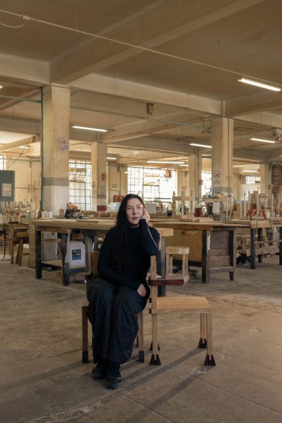 Marina Abramovic in a chair she designed