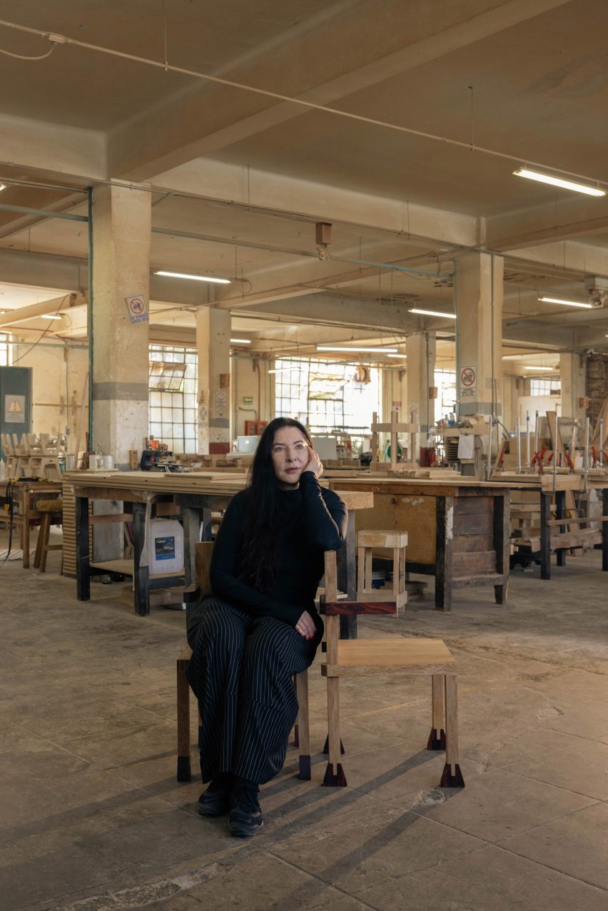 Marina Abramovic in a chair she designed