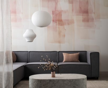 Pink watercolour-style textiles on sitting room wall