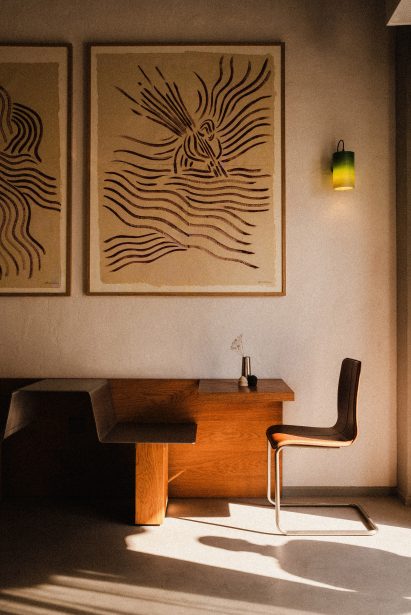 Wooden sideboard and steel-and-leather chair