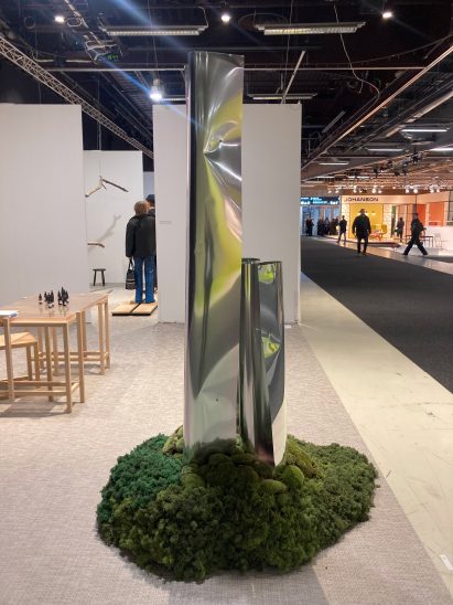 Metal plinth standing in mossy footing