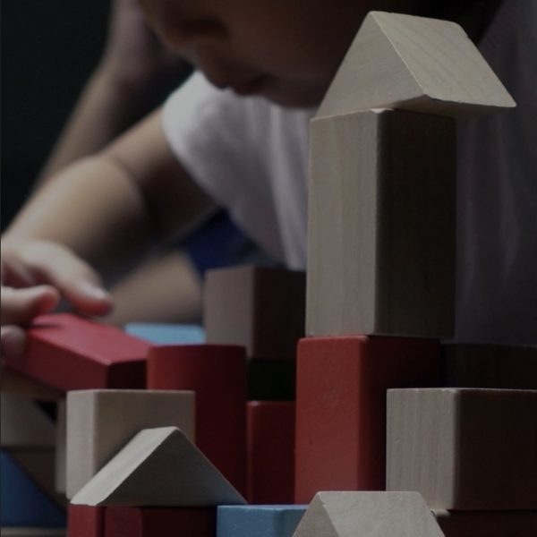 Photograph of a child playing with toys